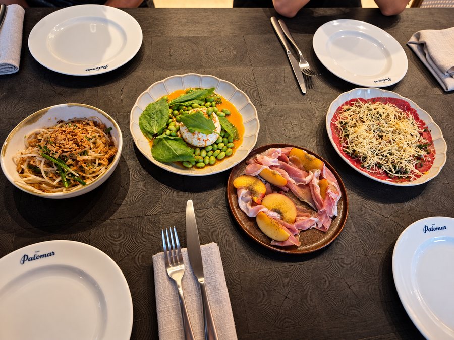 25hours Hotel The Olympia, shared plates set on a restaurant table