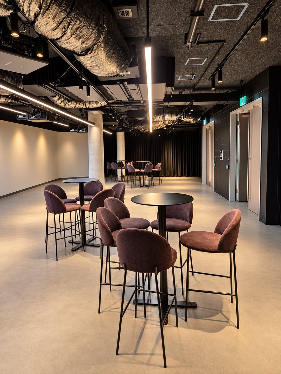25hours Hotel The Olympia, open event floor with high tables and exposed ceiling services