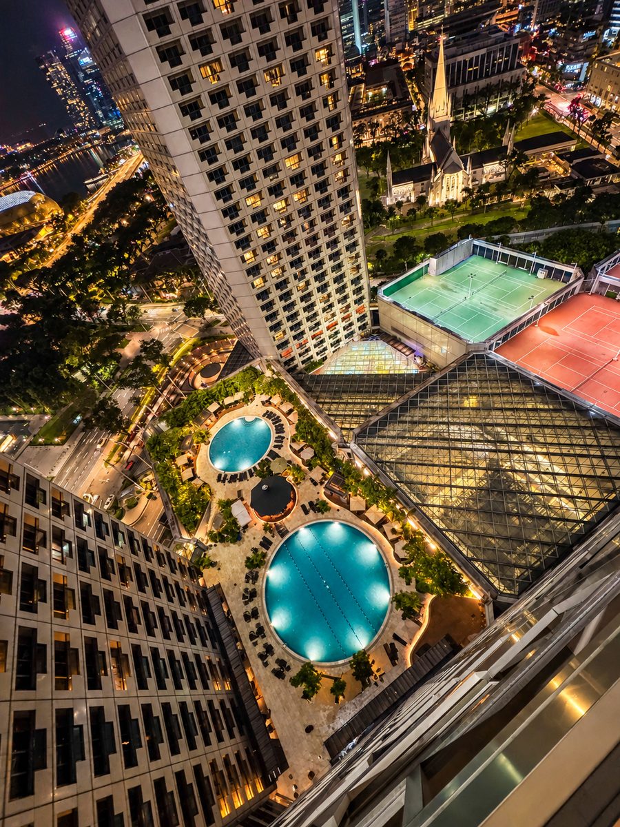 Fairmont Singapore, the view down to the pool deck at night