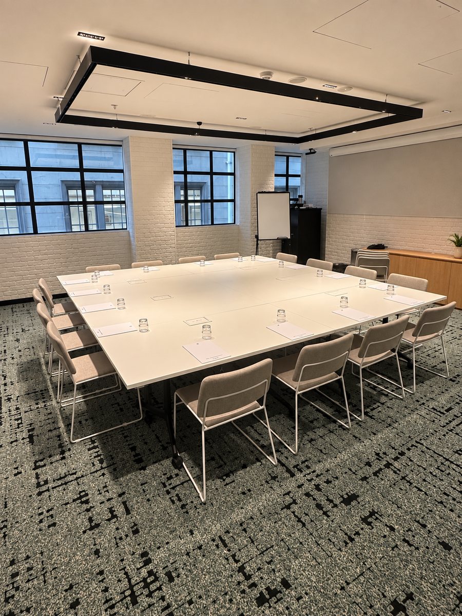 Holiday Inn Melbourne Bourke Street Mall, meeting room set in a hollow square, with white brick walls and black framed windows