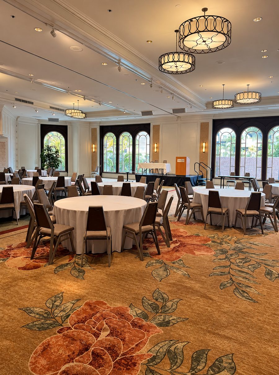 Moana Surfrider, A Westin Resort & Spa, an event room set with round tables in front of a stage