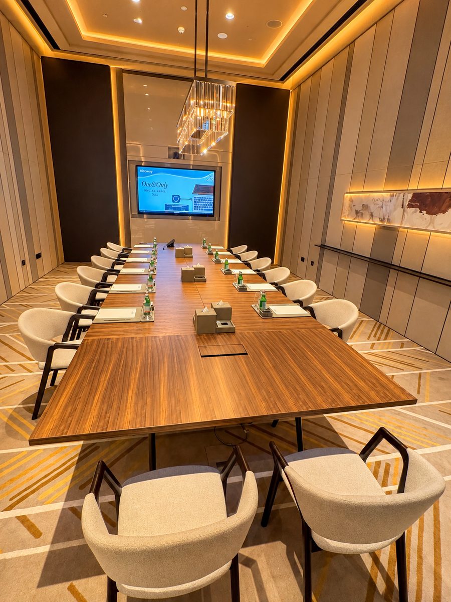 One&Only One Za’abeel, boardroom with a long timber table, a crystal pendant and a wall screen