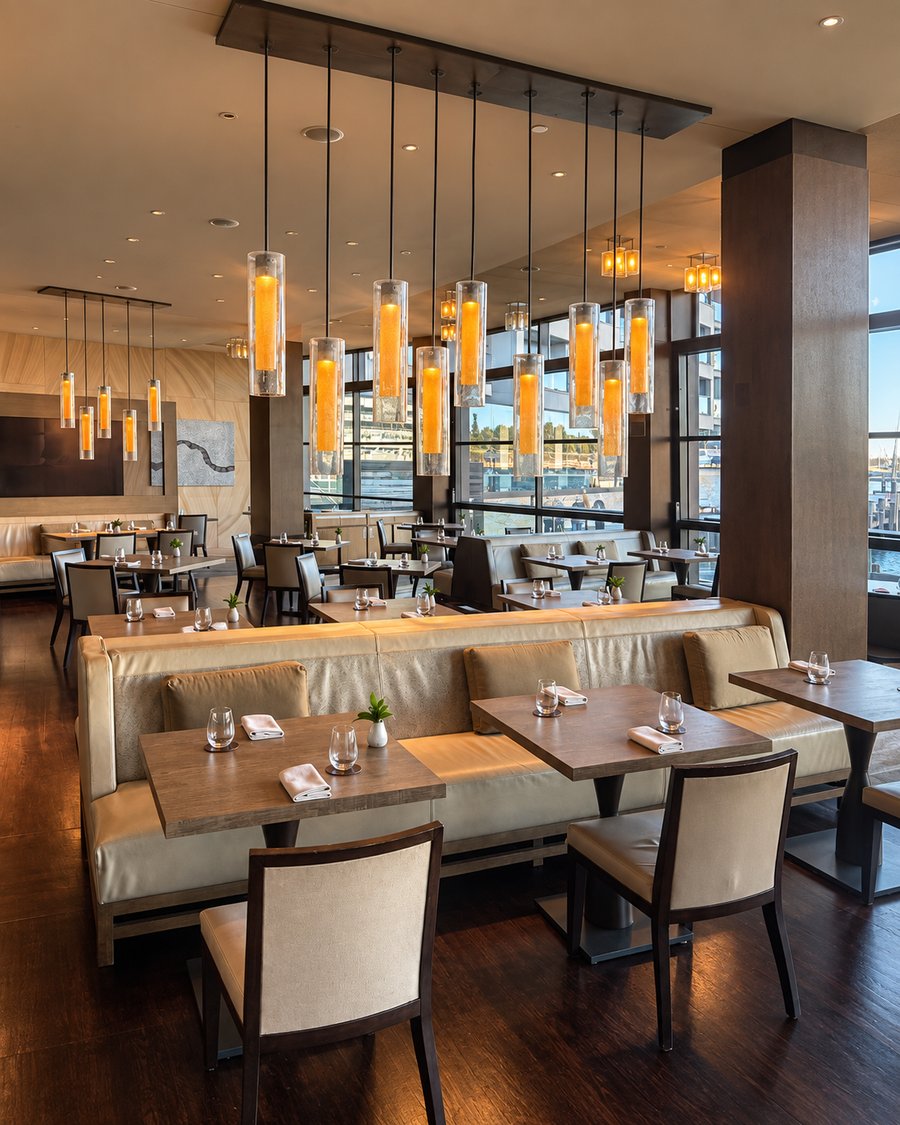 Park Hyatt Sydney, restaurant with amber glass pendants over banquette seating and harbour windows